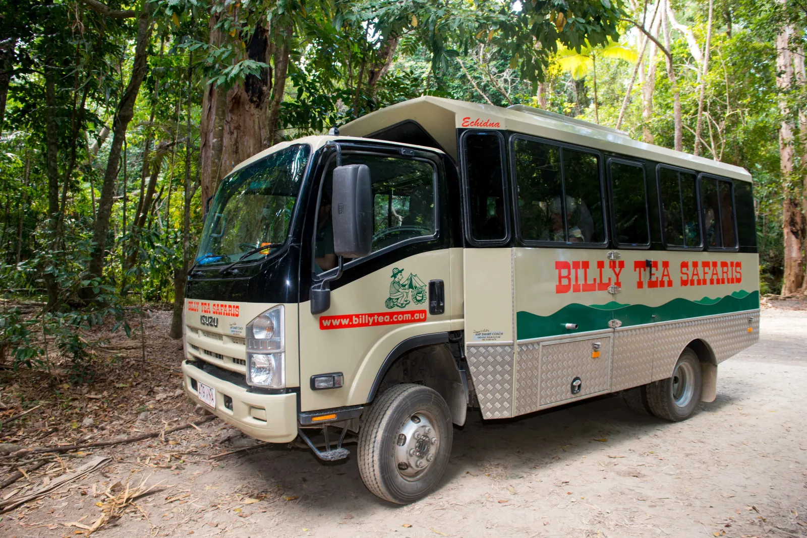Billy Tea Safaris four-wheel-drive bus parked in the rainforest
