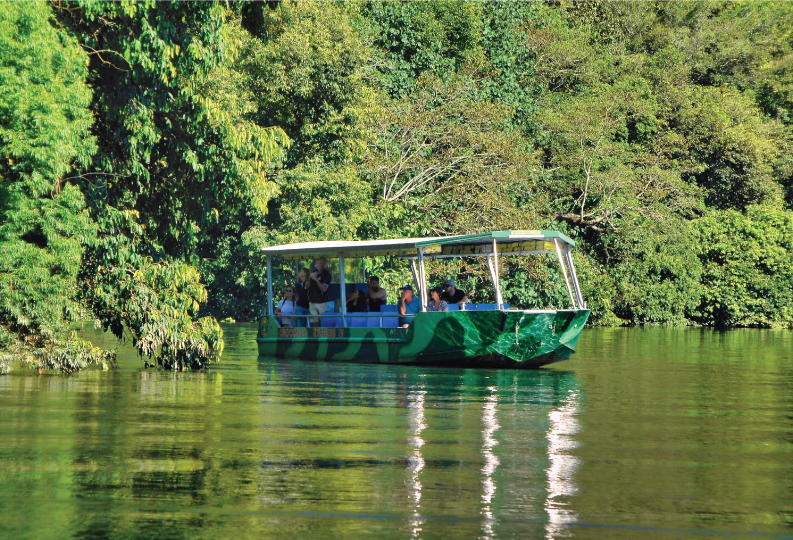 Crocodile Express cruise boat on a calm reach of the Daintree River