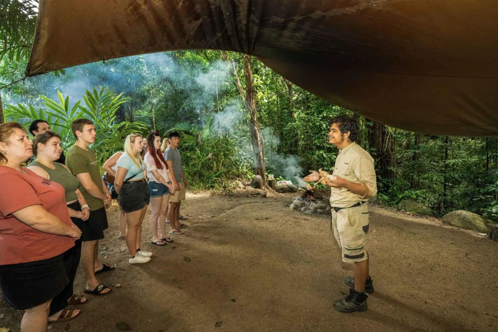 Guide addressing a group at a smoking ceremony